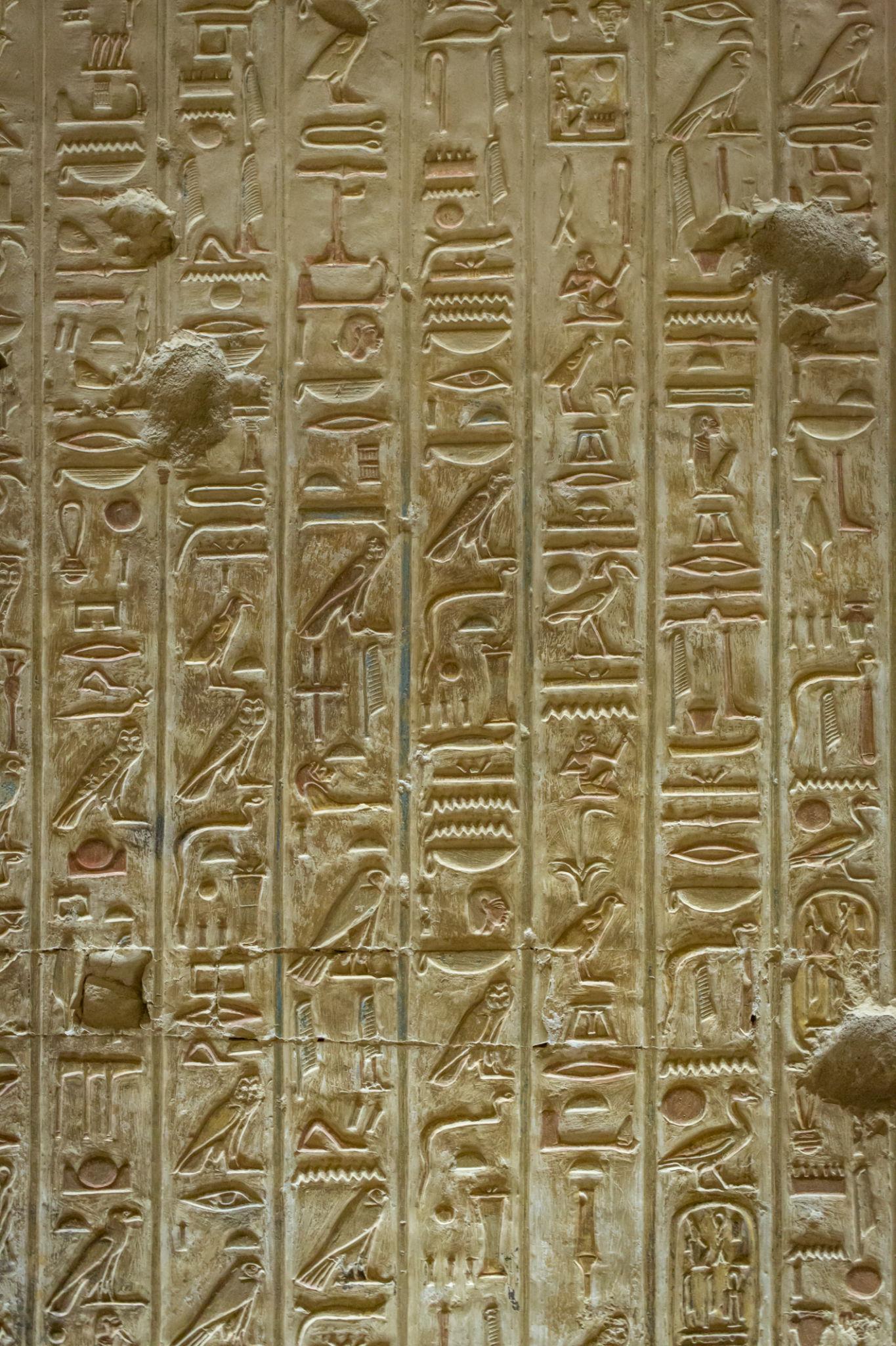 Vertical columns of finely carved hieroglyphs at the Temple of Seti I.