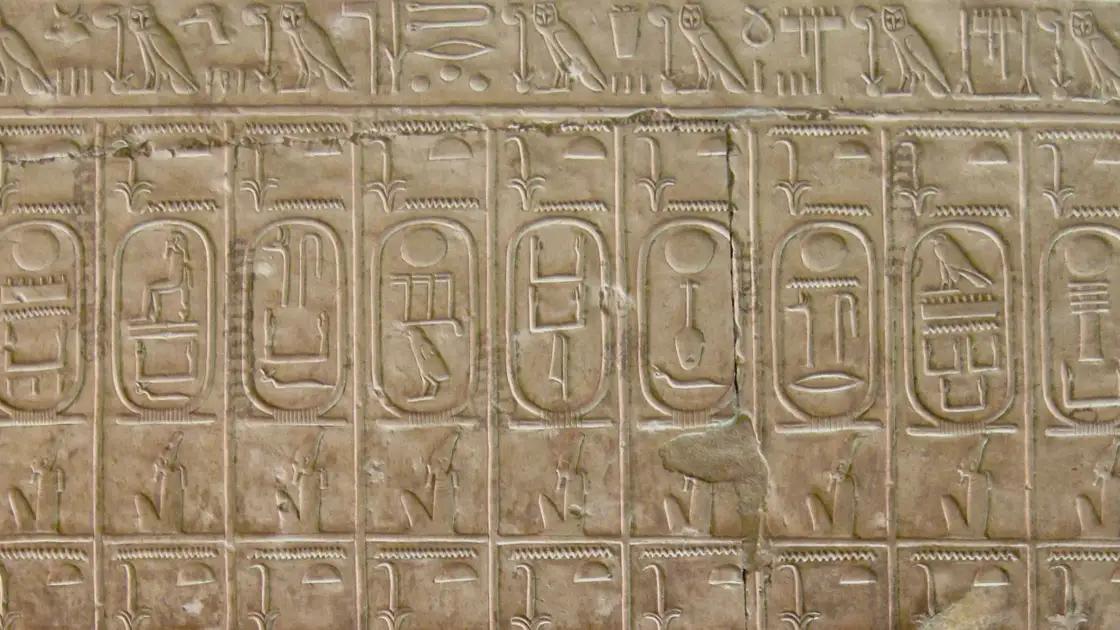 The Abydos King List with cartouches of pharaohs carved into the temple wall.
