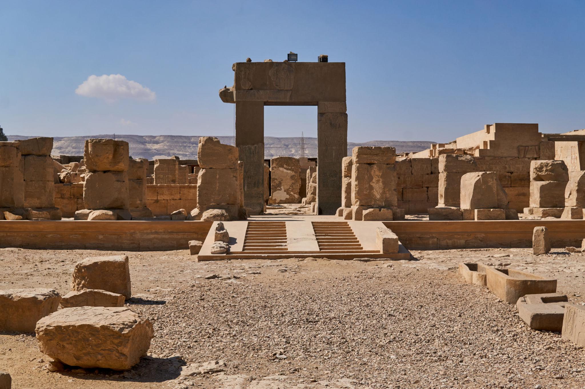 Stone ruins and gateway of the Osireion behind the Temple of Seti I.