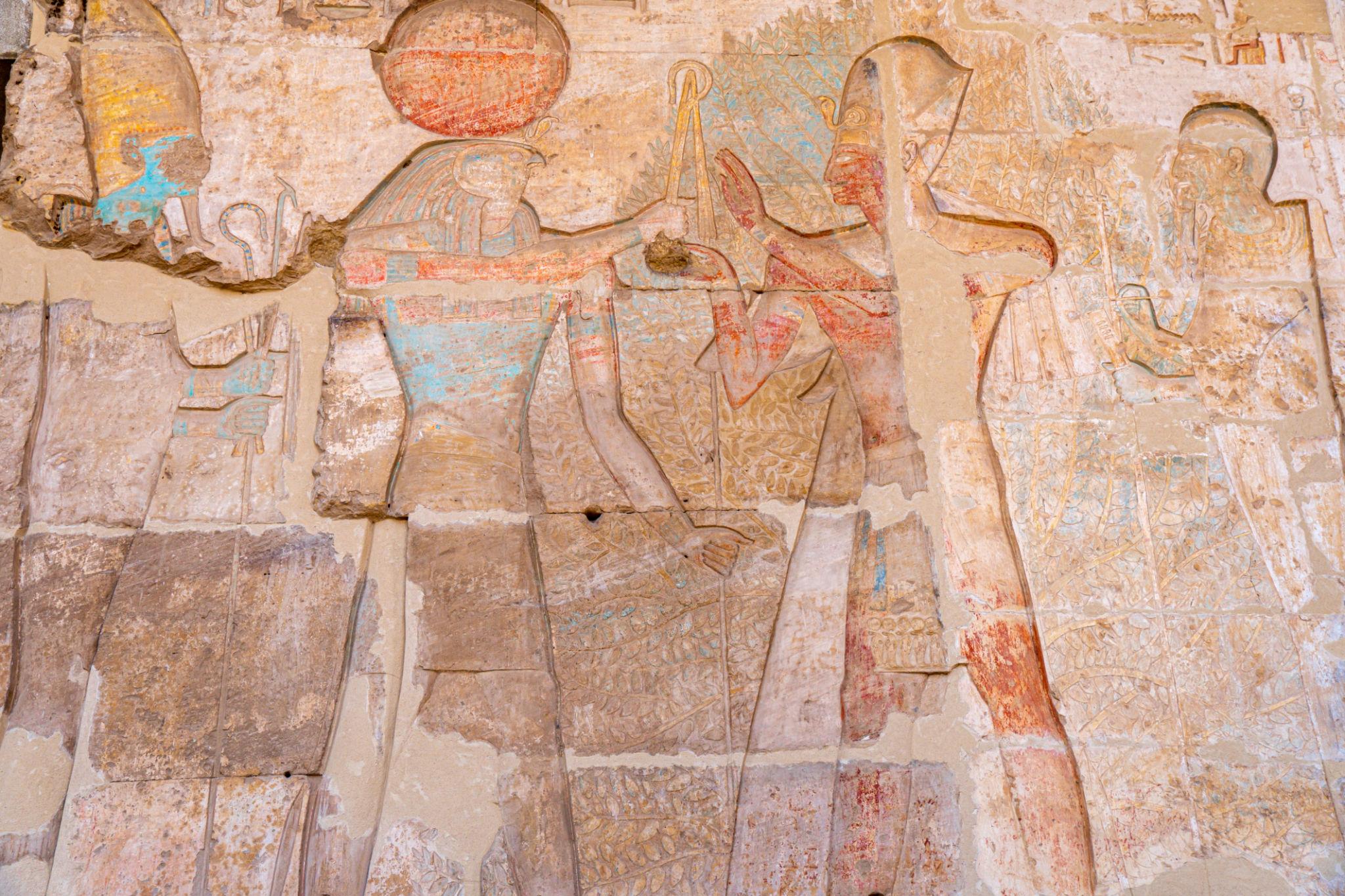 Painted relief of deities with traces of original pigment at Abydos Temple.