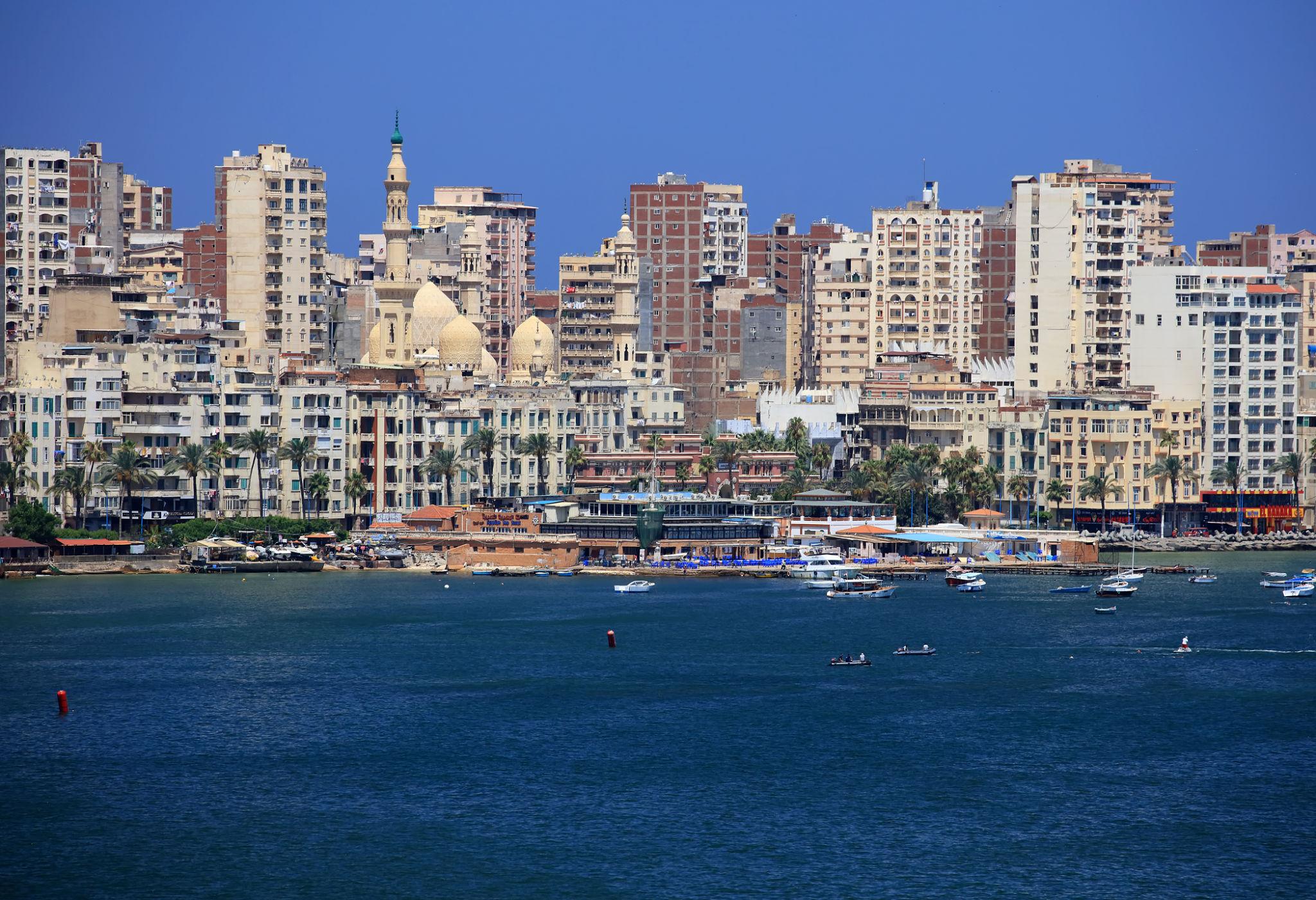 Alexandria waterfront skyline of apartment towers and mosque seen across the Eastern Harbor