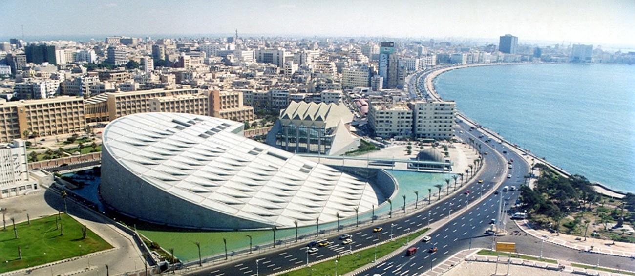 Aerial view of the disc-shaped Bibliotheca Alexandrina beside Alexandria's Mediterranean corniche