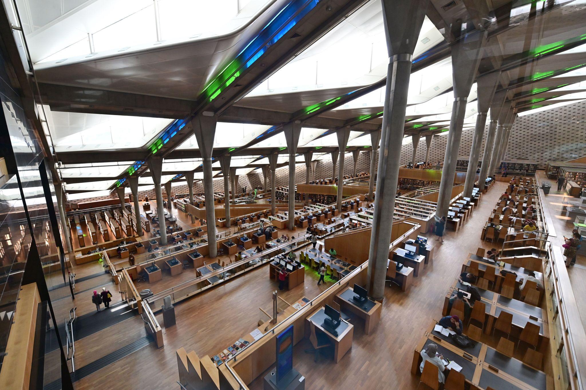 Terraced reading hall interior of the Bibliotheca Alexandrina with columns and natural light
