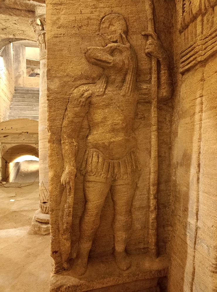 Life-size relief of jackal-headed Anubis dressed as a Roman legionary guarding the tomb entrance