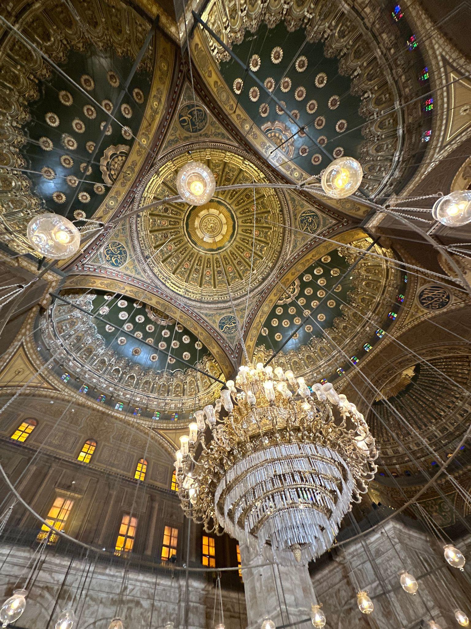 Ornate gilded dome and crystal chandelier inside the Muhammad Ali Alabaster Mosque
