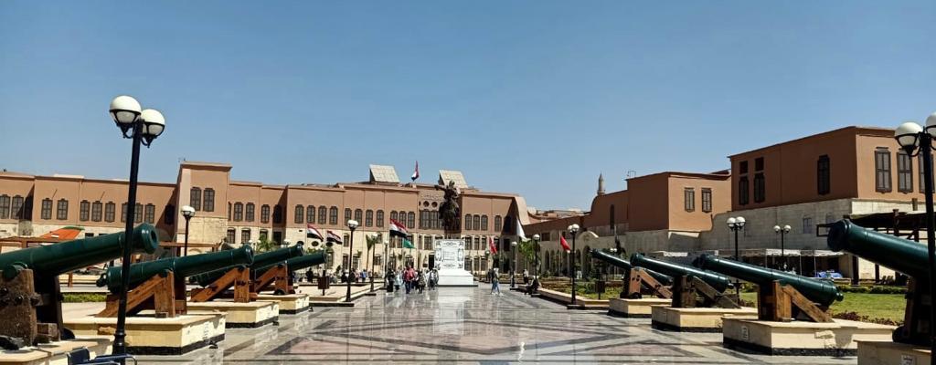 Citadel plaza lined with historic cannons leading to the National Military Museum entrance