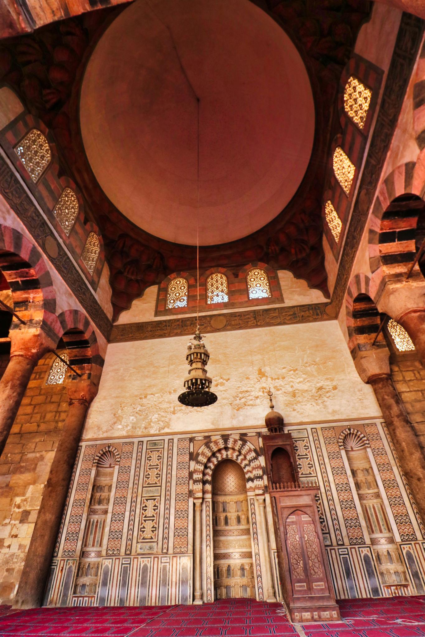 Ornate mihrab and painted dome inside a mausoleum chamber at the Citadel of Saladin