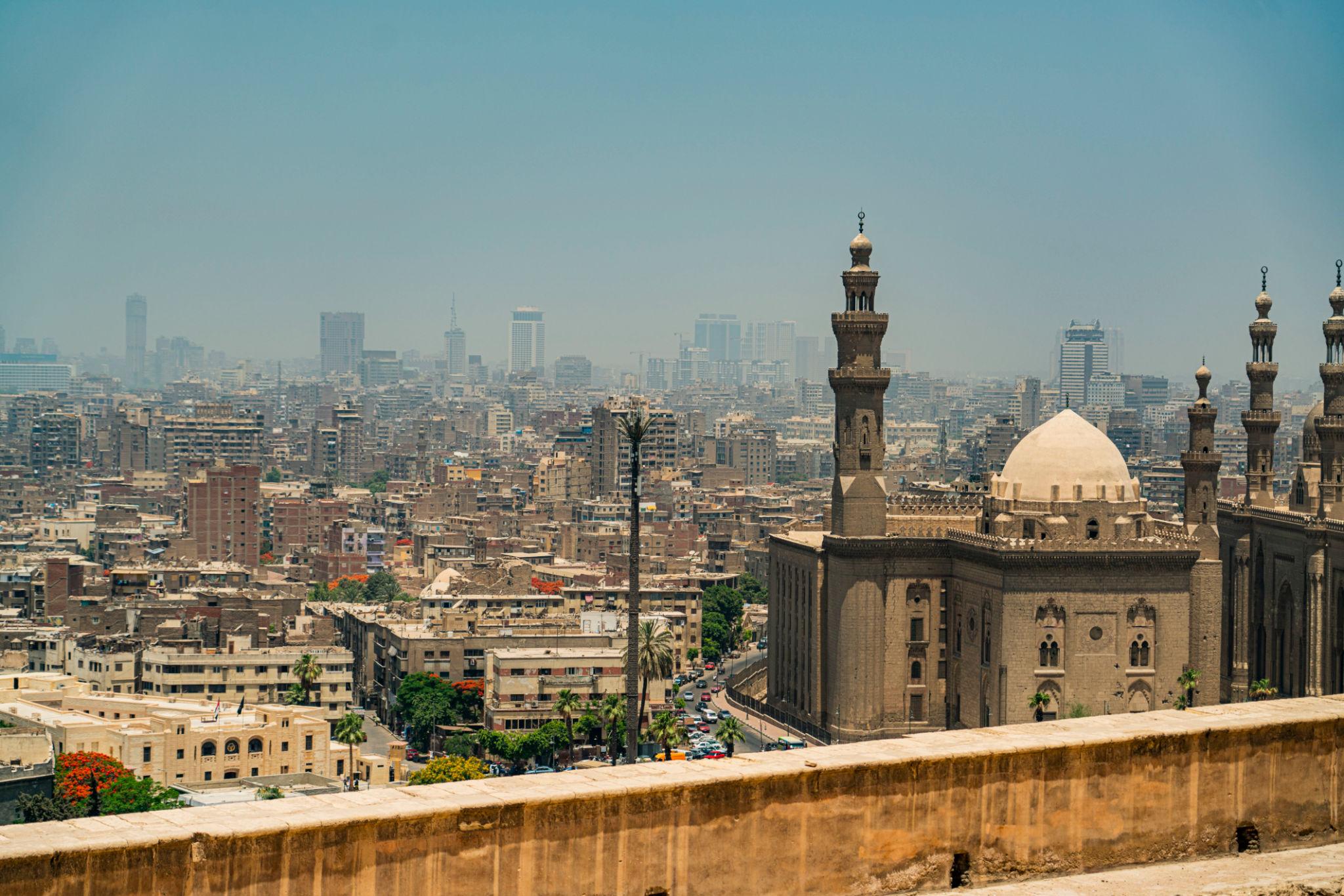 Sultan Hassan mosque dome and minarets rising above the Cairo necropolis skyline