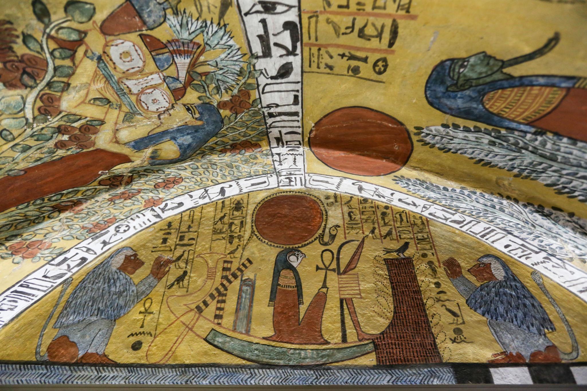 Vaulted tomb ceiling painted with solar barque, hieroglyphs and deities in Deir el-Medina artisans' tomb