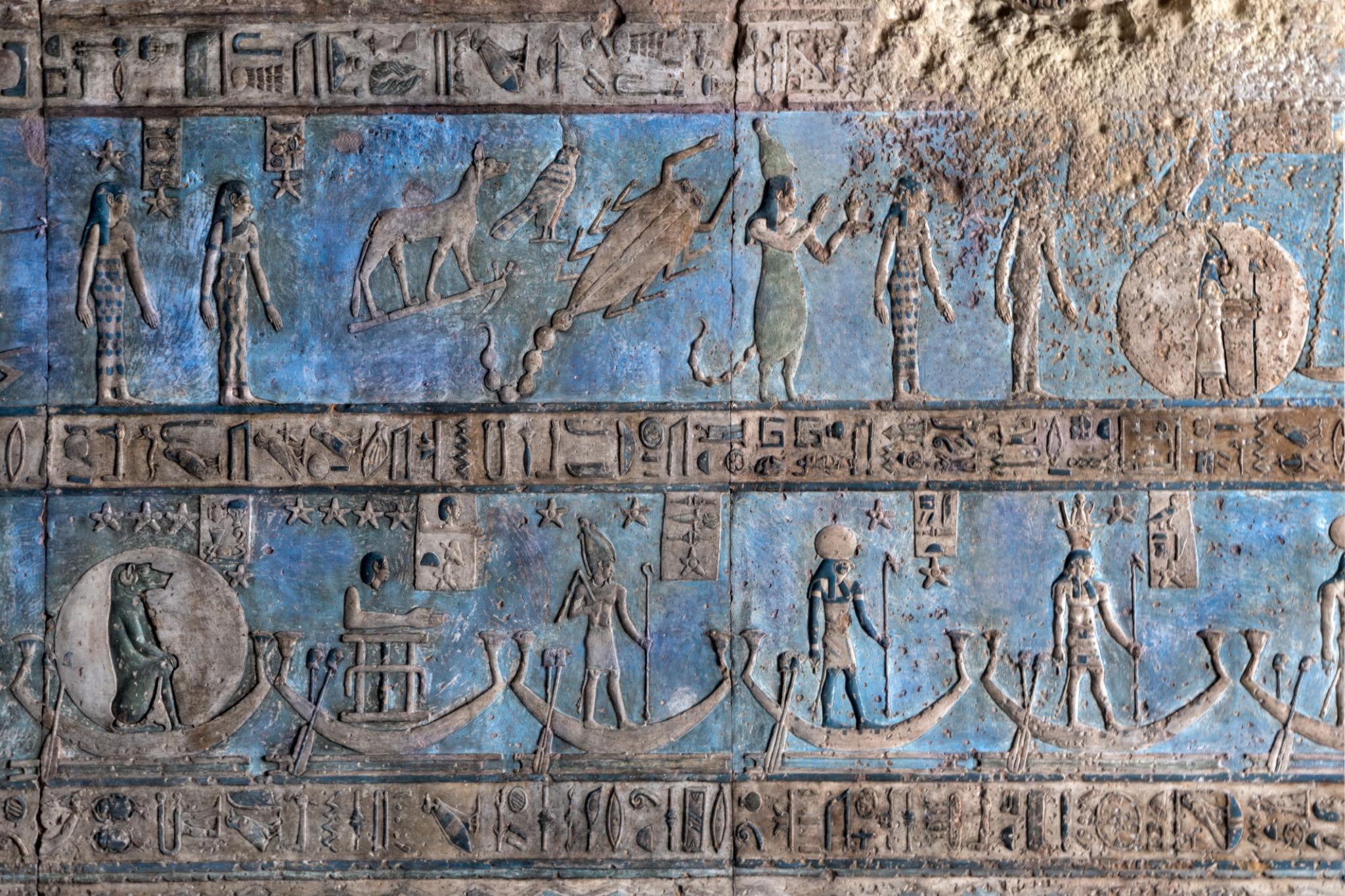 Painted astronomical ceiling panels with gods sailing celestial barques at Dendera.