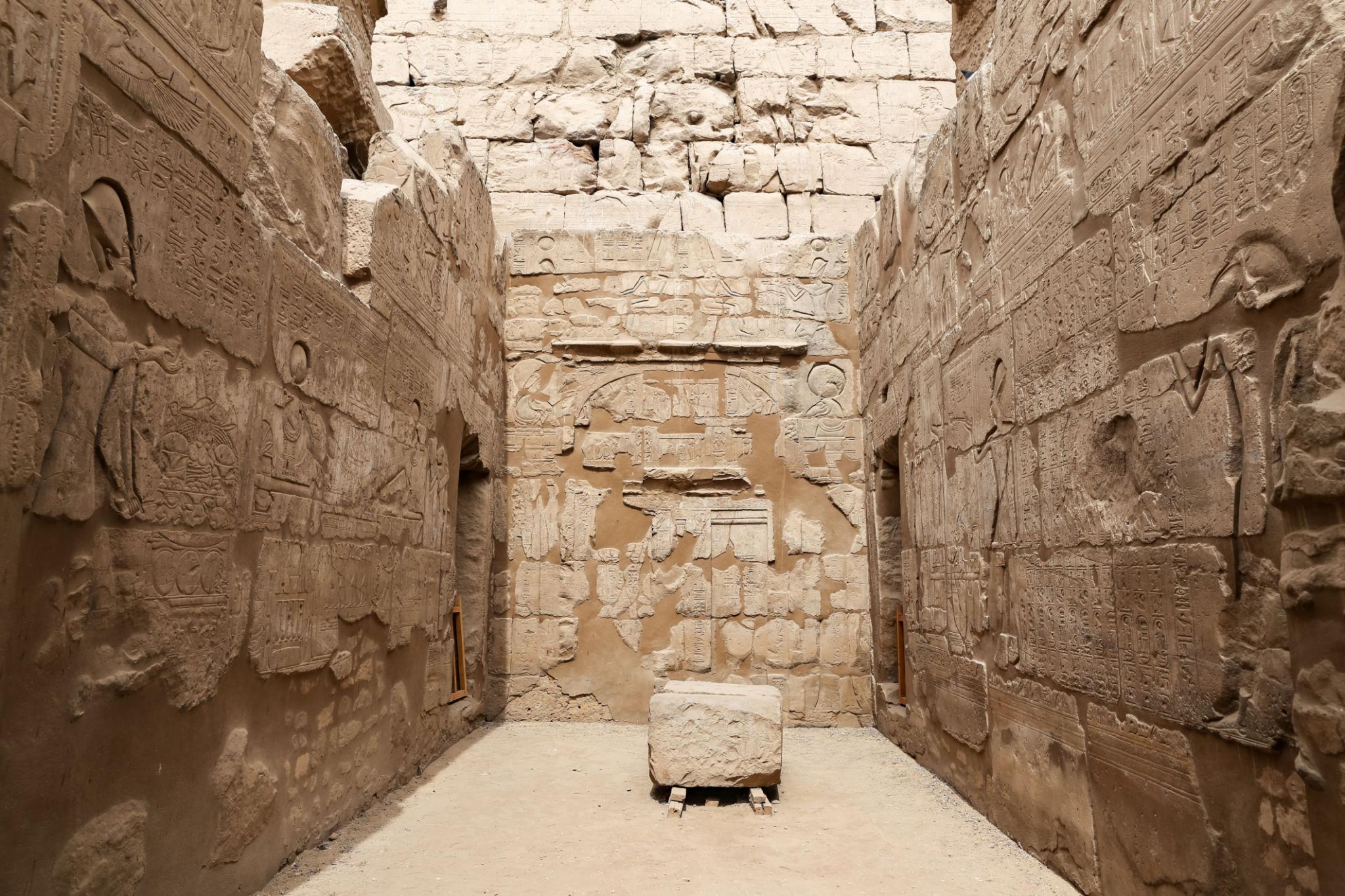 Inner sanctuary chamber with carved wall reliefs and hieroglyphs at Hatshepsut Temple