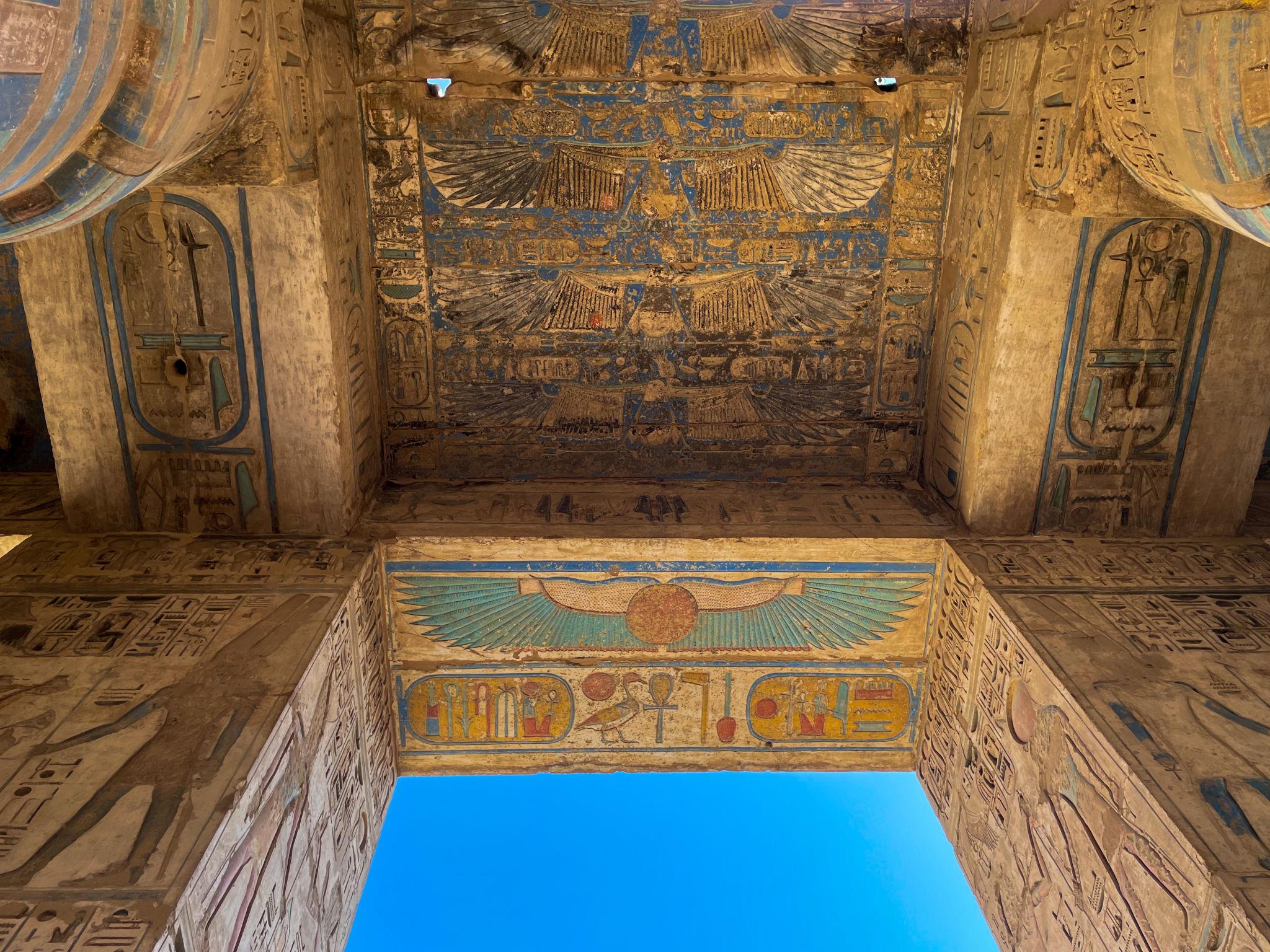 Painted ceiling with winged vulture goddess and hieroglyphs at Karnak Temple