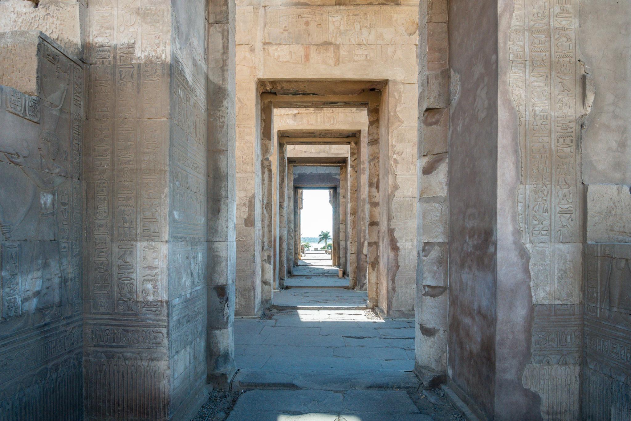 Twin doorways of the symmetric double sanctuary aligned in perspective at Kom Ombo.