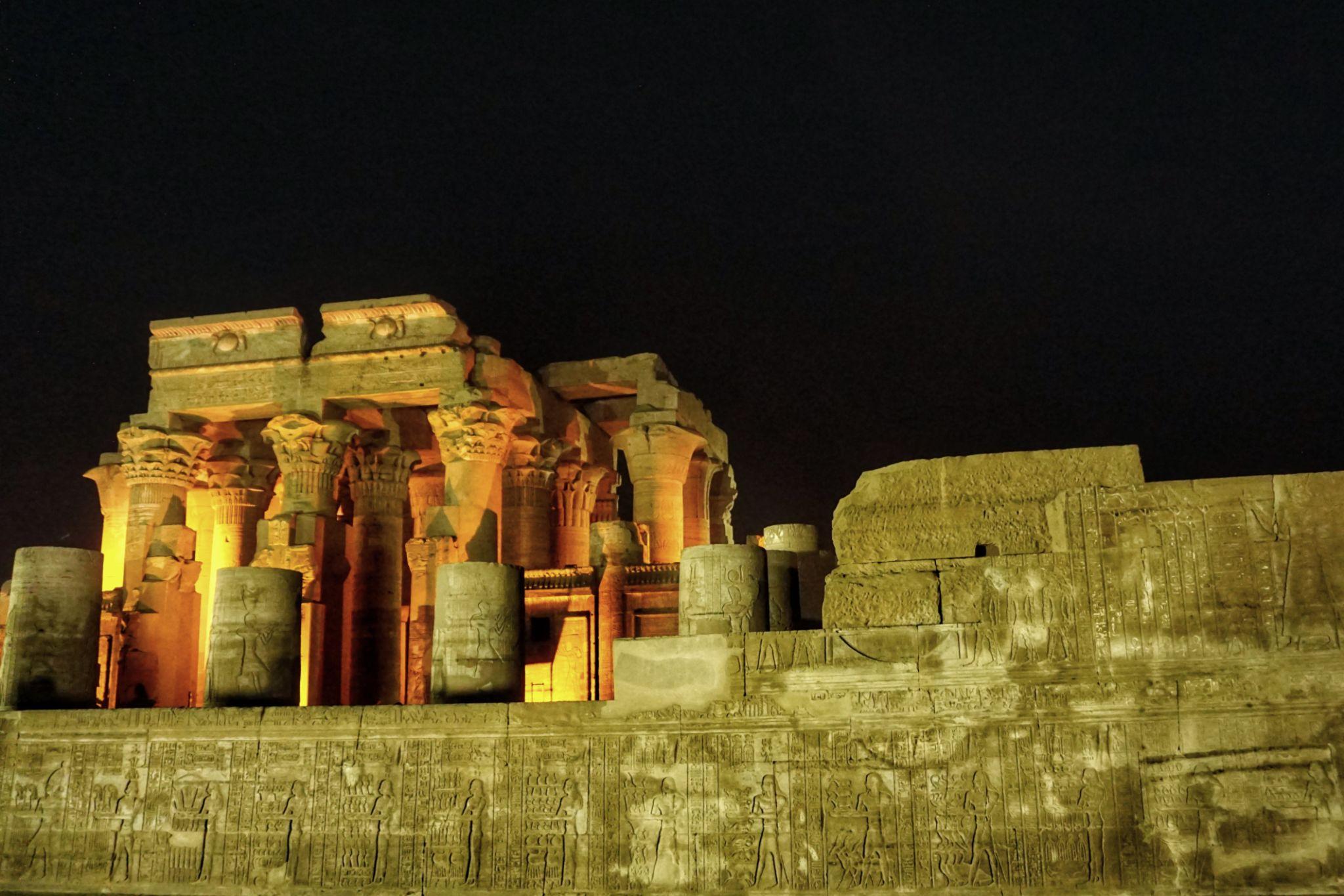 Kom Ombo Temple's symmetric double sanctuary dramatically lit at night.