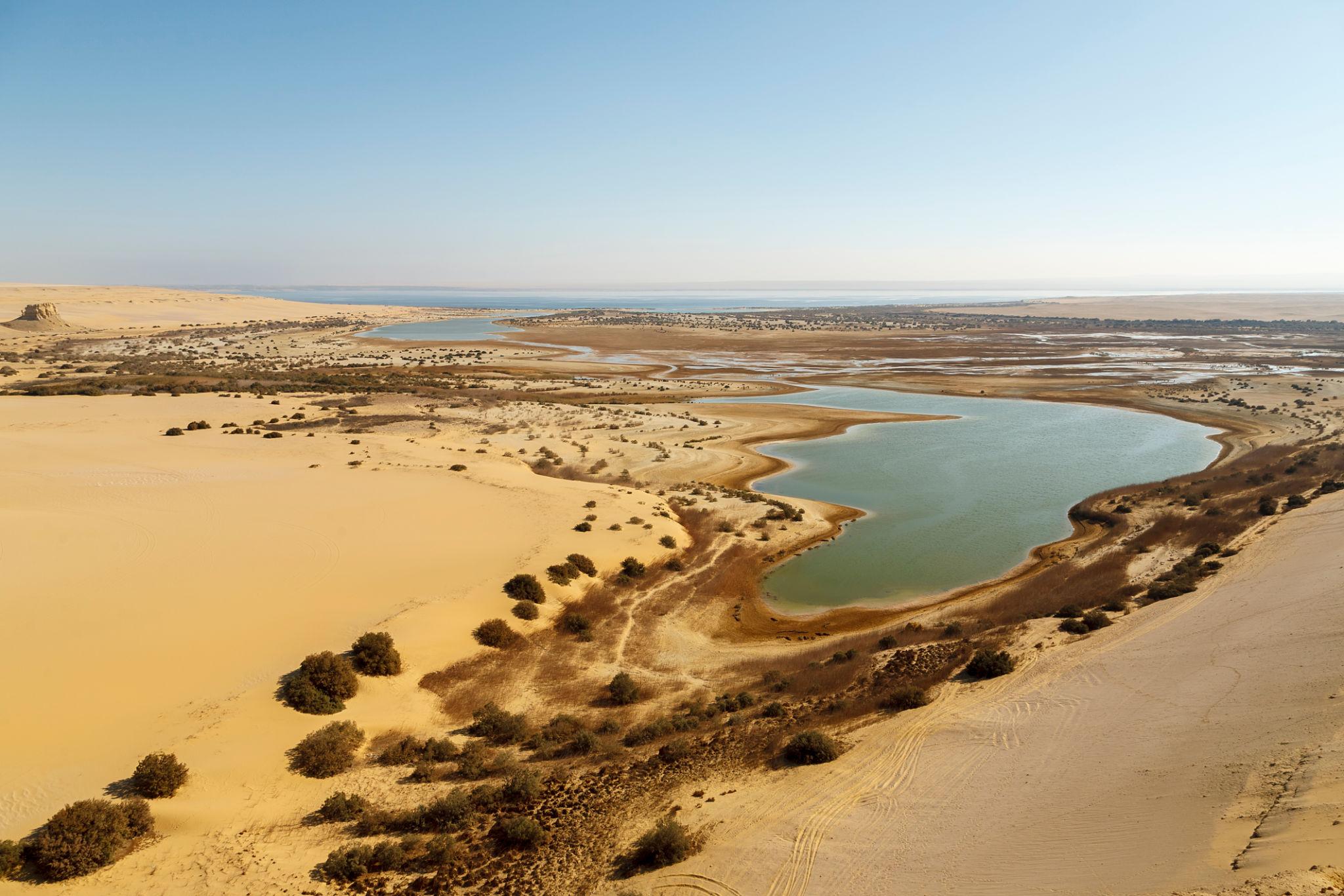 Aerial view of the Magic Lake nestled in the Fayoum desert landscape