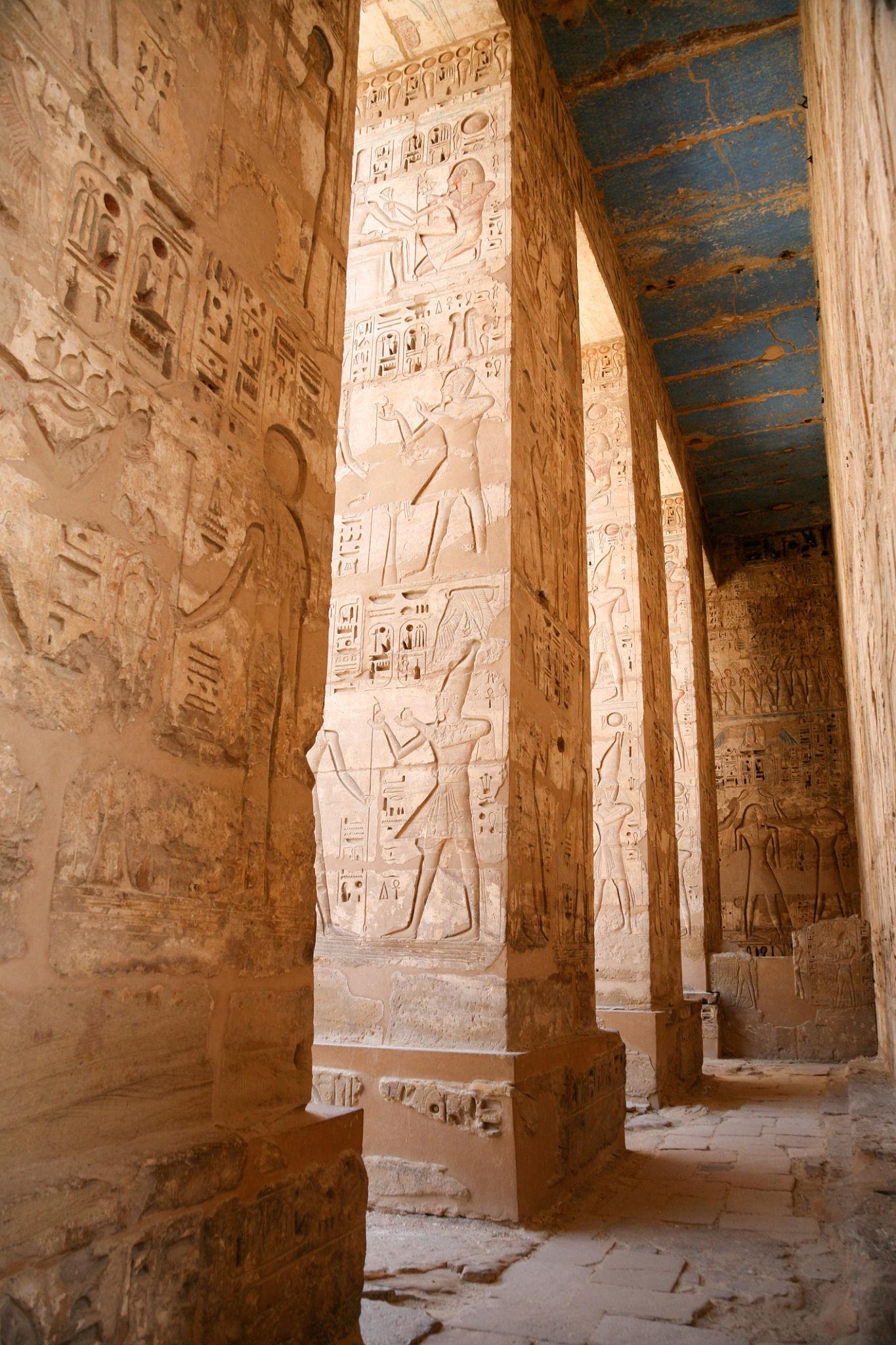 Row of Osiride pillars with sunken reliefs of Ramesses III at Medinet Habu.