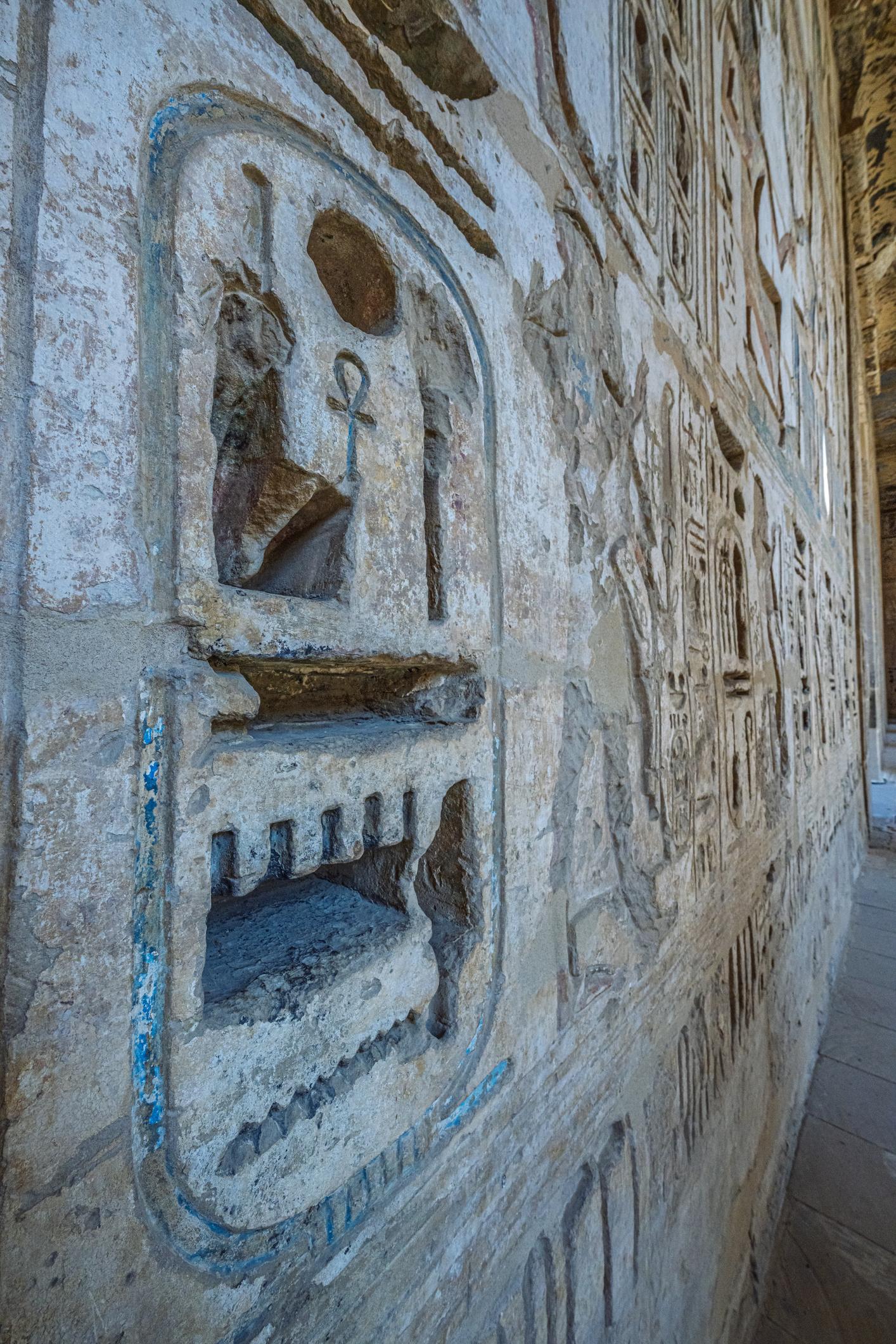 Close-up of a carved royal cartouche of Ramesses III on a Medinet Habu wall.