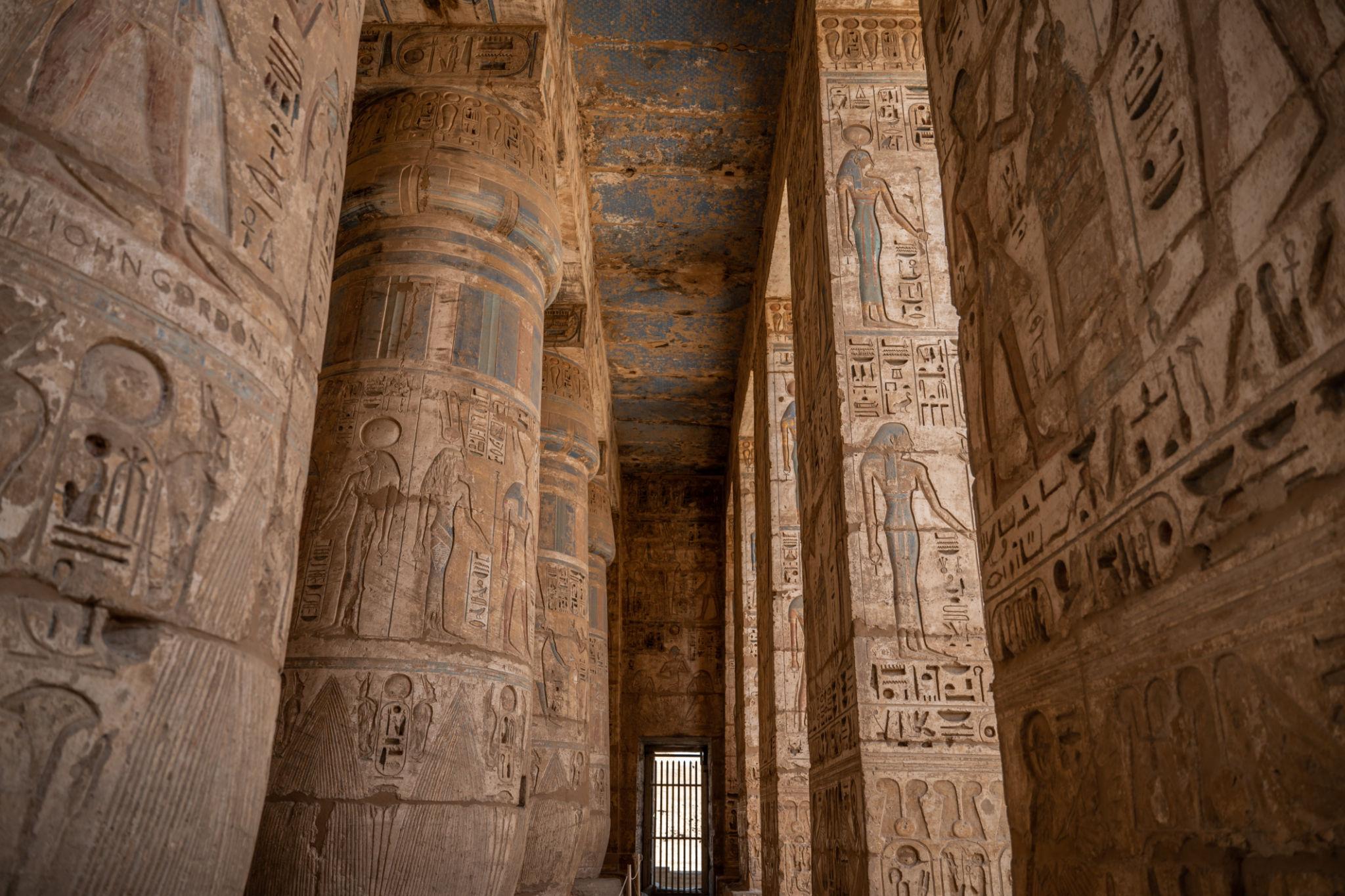 Pillared corridor of the second court showing reliefs of gods at Medinet Habu.