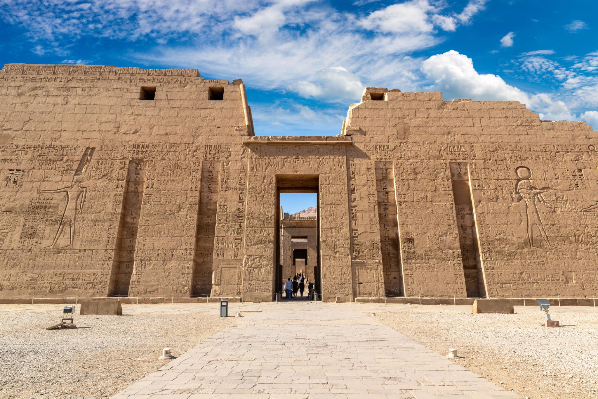 Massive second pylon of Ramesses III's temple with central doorway at Medinet Habu.