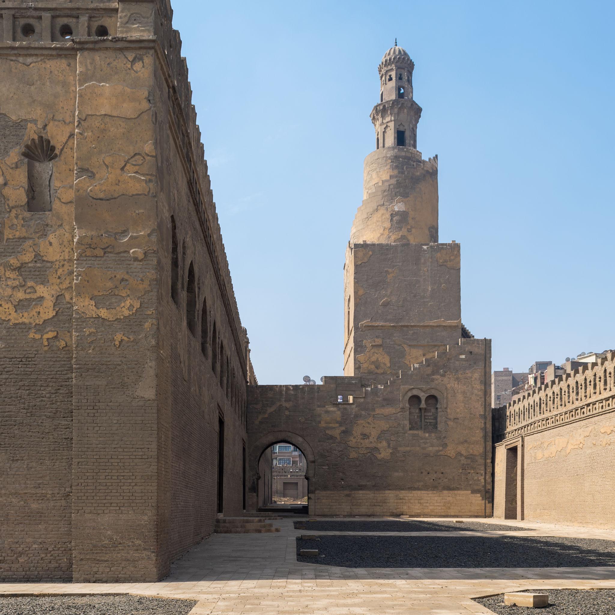 Iconic spiral minaret of Ibn Tulun Mosque rising above the outer walls