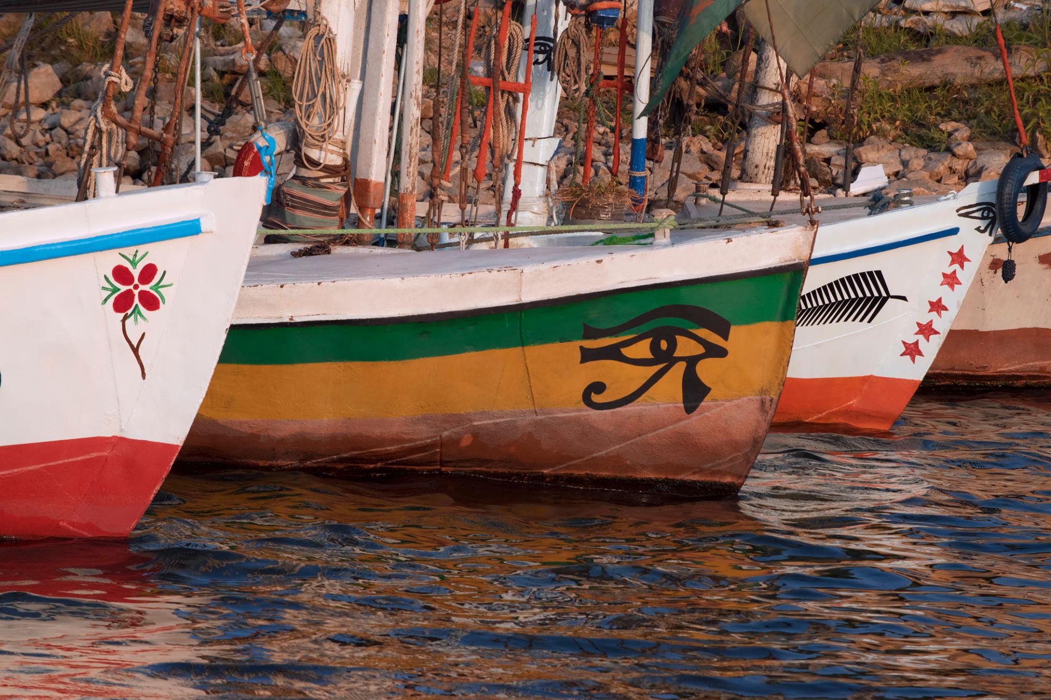 Painted felucca bows with Eye of Horus decorations on the Luxor Nile