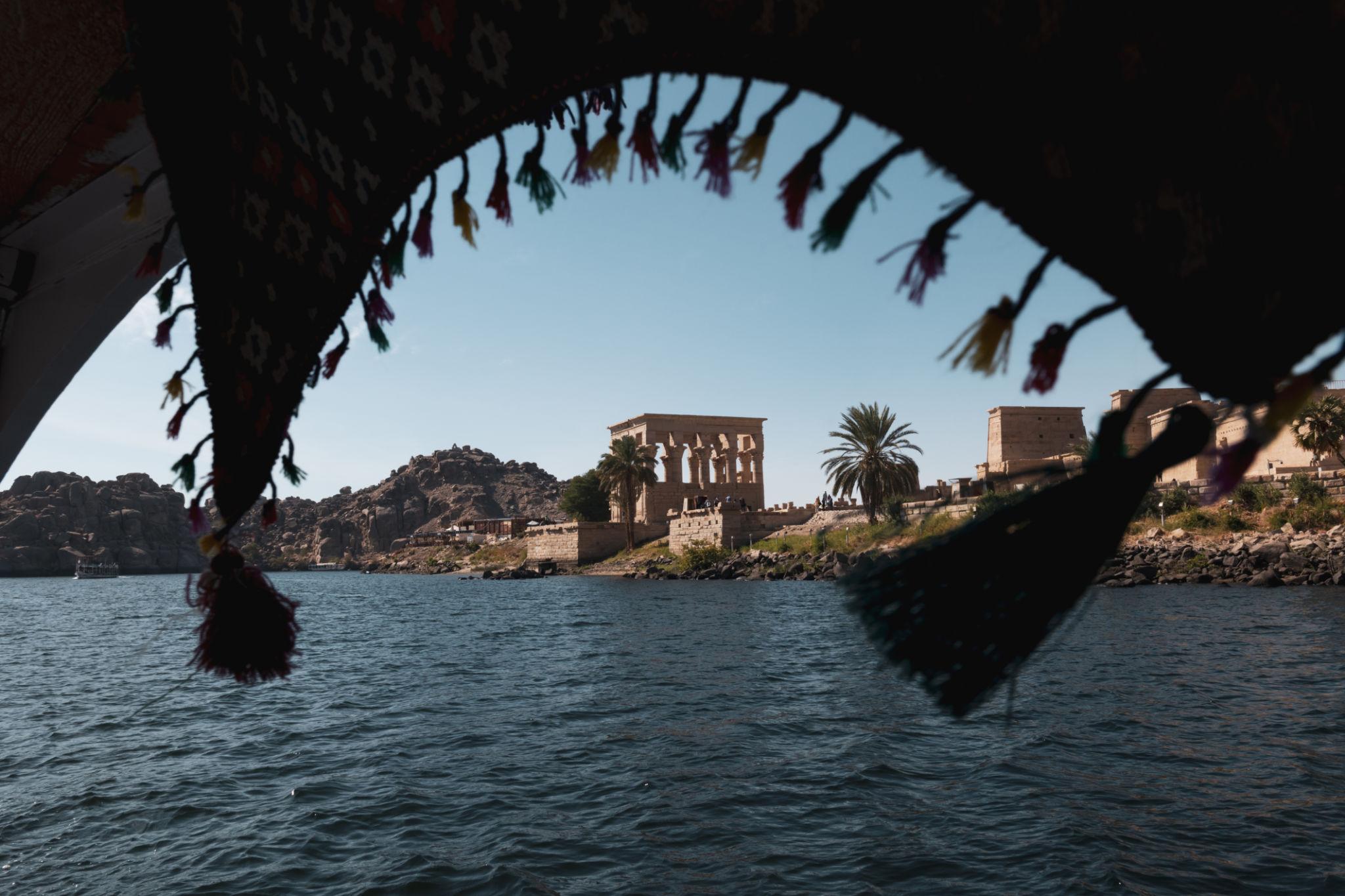 Philae Temple's Kiosk of Trajan viewed from a decorated felucca on the Nile