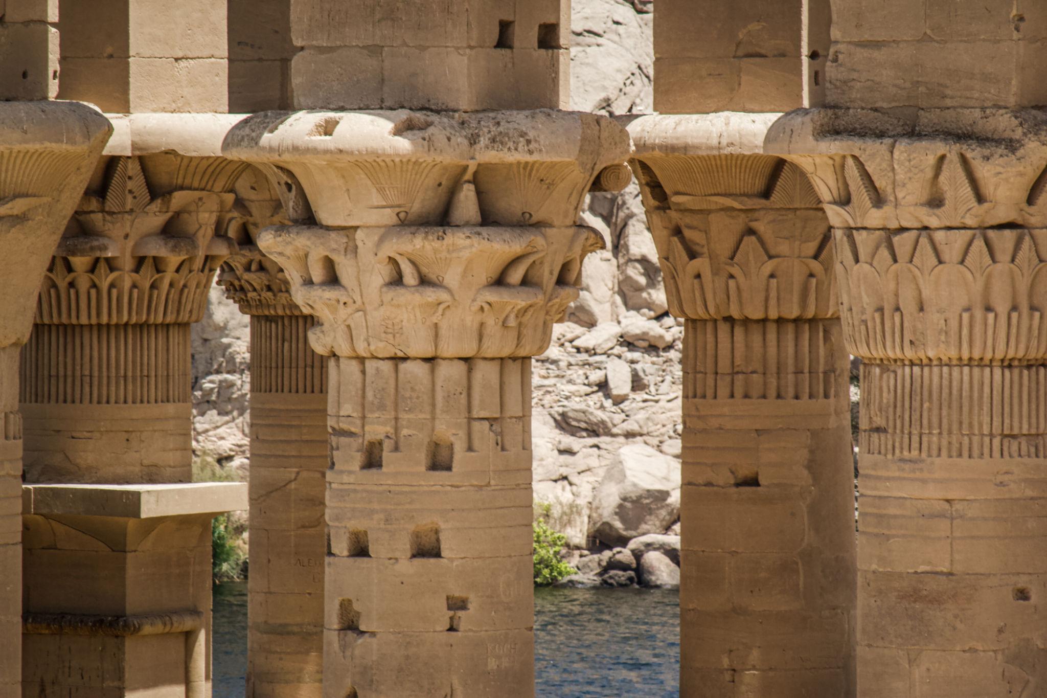 Close-up of carved lotus and papyrus capitals crowning the colonnade columns at Philae Temple on Agilkia Island