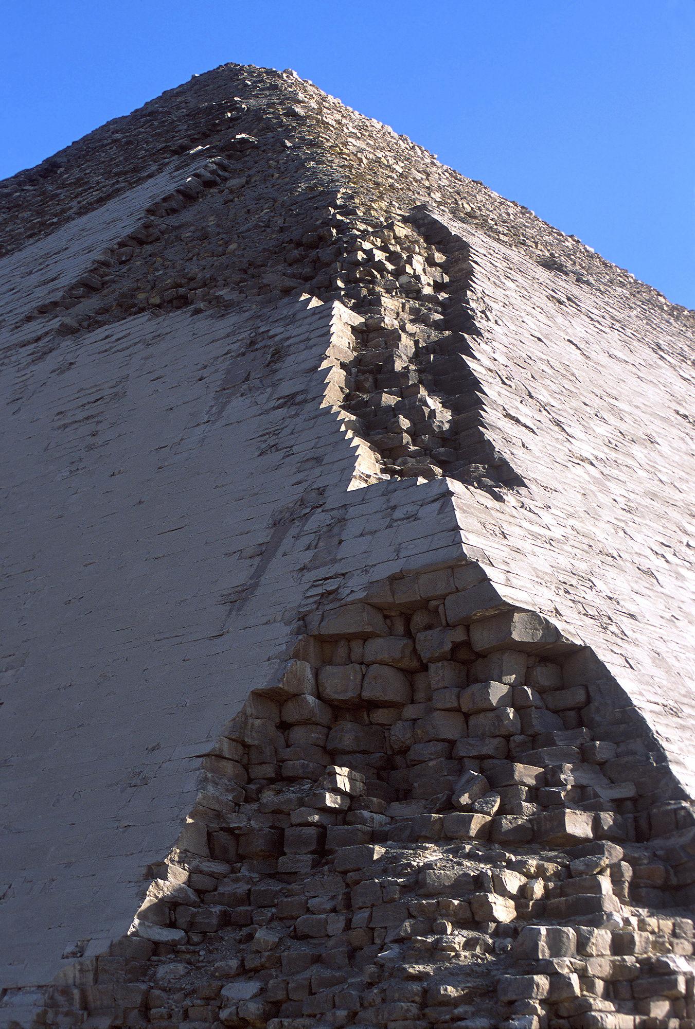 Close-up of the Red Pyramid's corner edge showing original white limestone casing stones intact