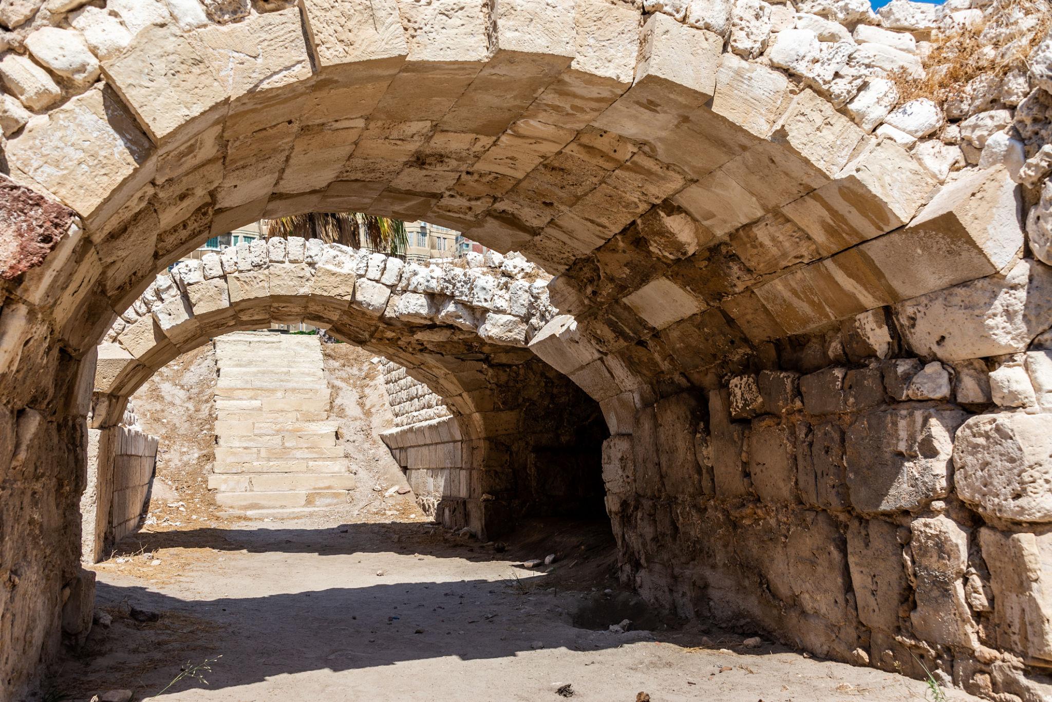 Ancient stone vaulted archways and passage inside the Roman amphitheatre complex, Alexandria