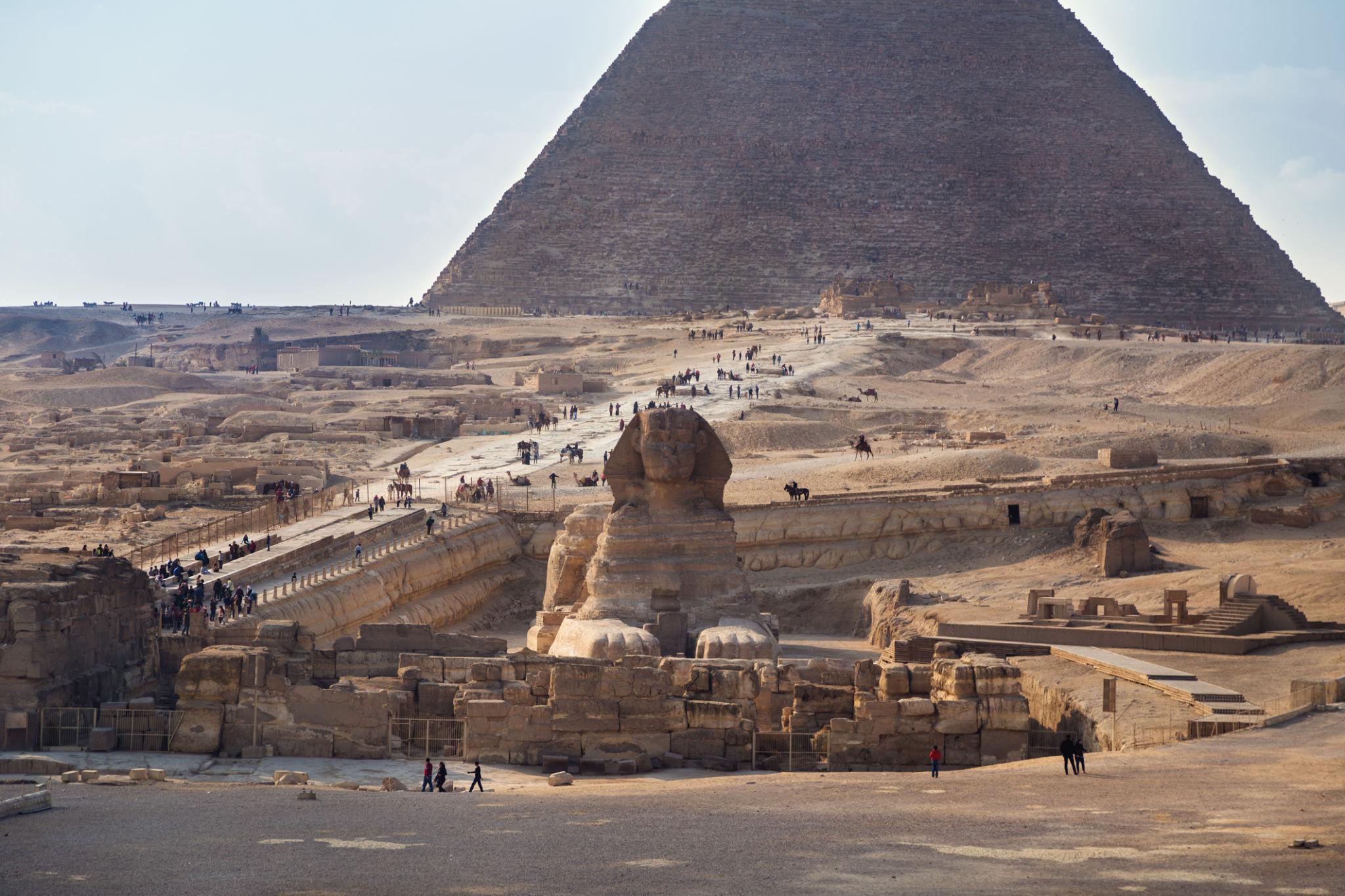 The Great Sphinx of Giza in the foreground with the Great Pyramid rising behind it.