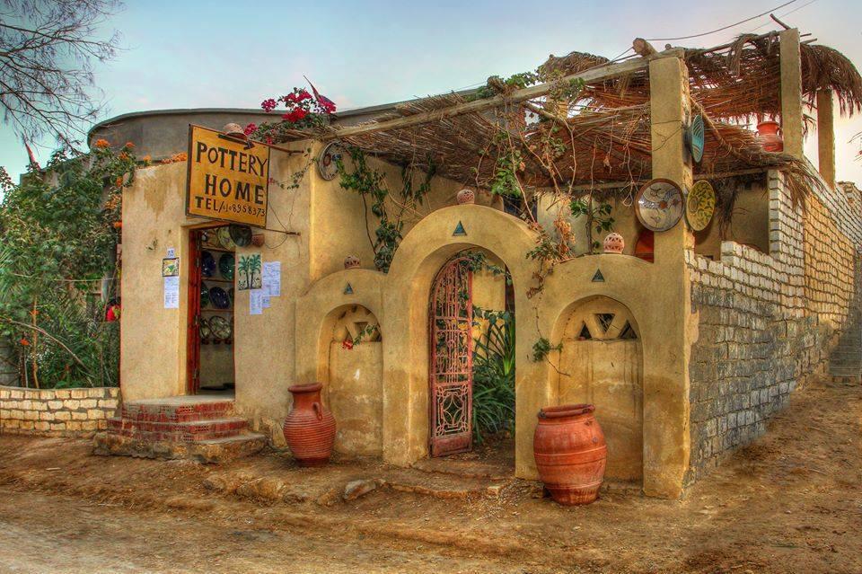 Rustic Pottery Home studio with arched facade and clay urns in Tunis Village, Fayoum