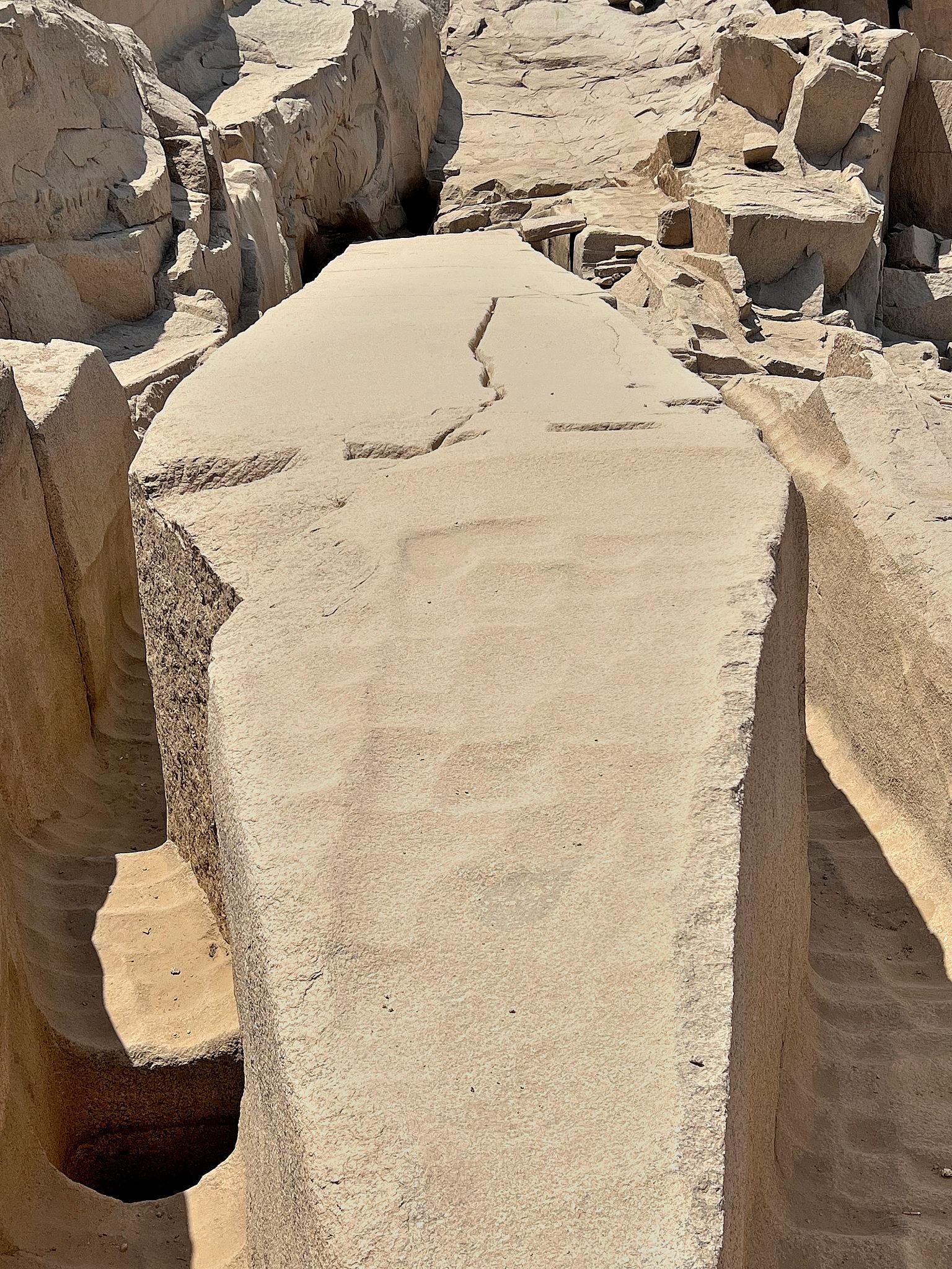 Close-up of the massive unfinished obelisk still attached to bedrock in an Aswan quarry