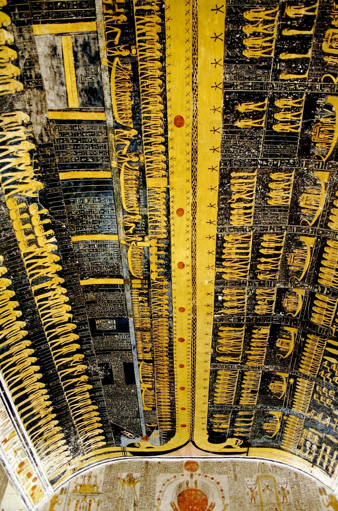 Detailed yellow and black ceiling painting depicting scenes from the Book of Gates.