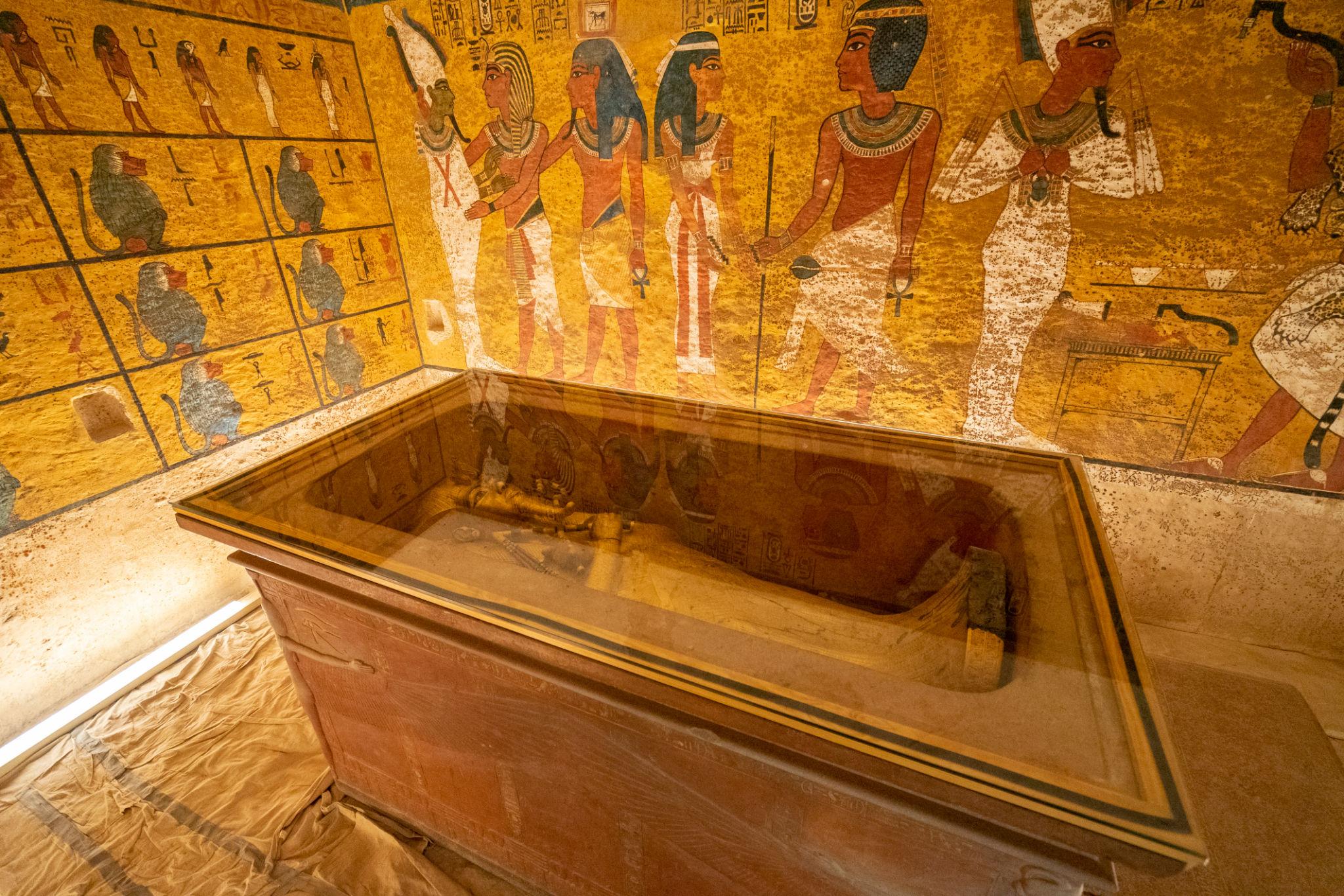 Golden sarcophagus of Tutankhamun displayed inside his burial chamber in tomb KV62.