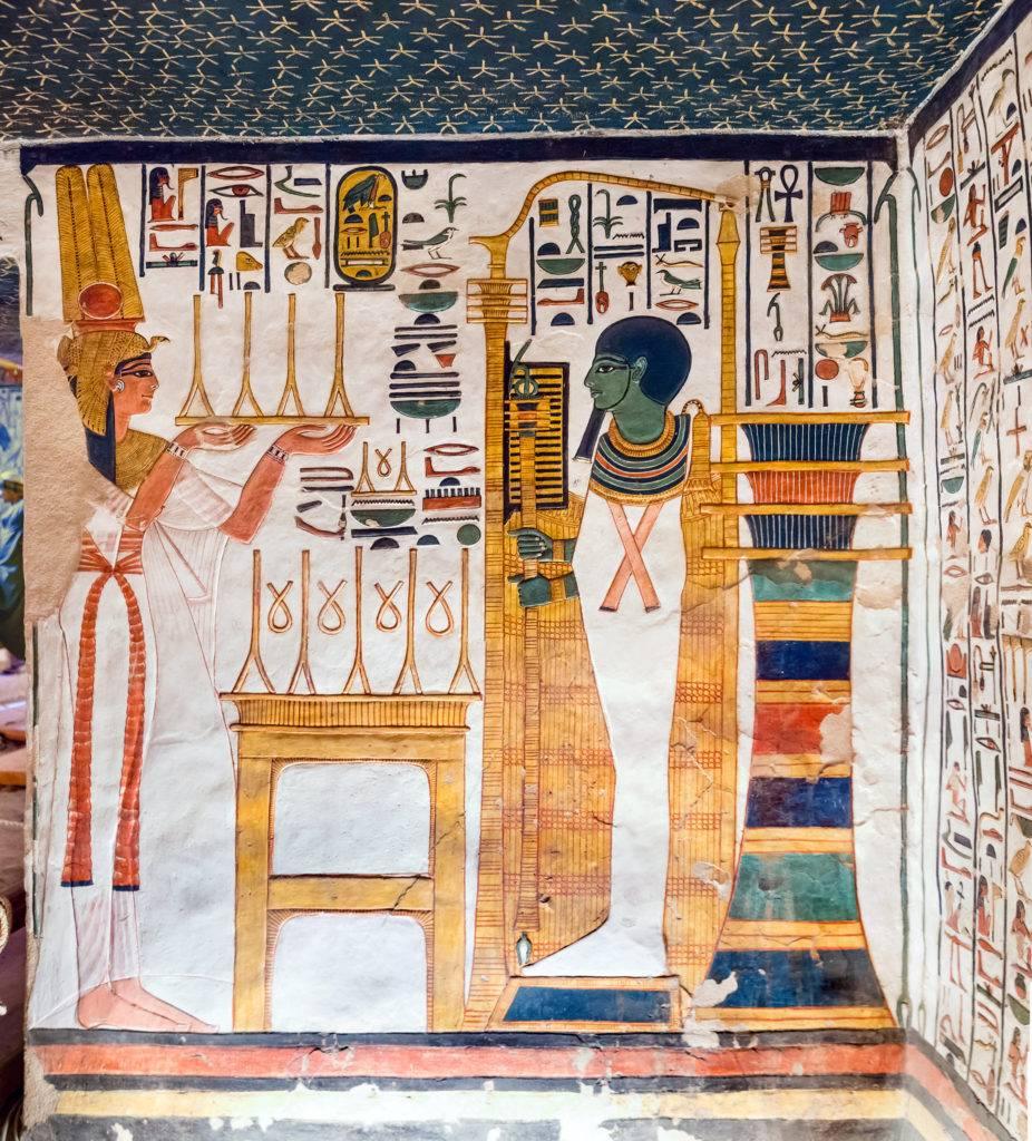 Nefertari presenting offerings before the god Ptah enshrined in his kiosk.