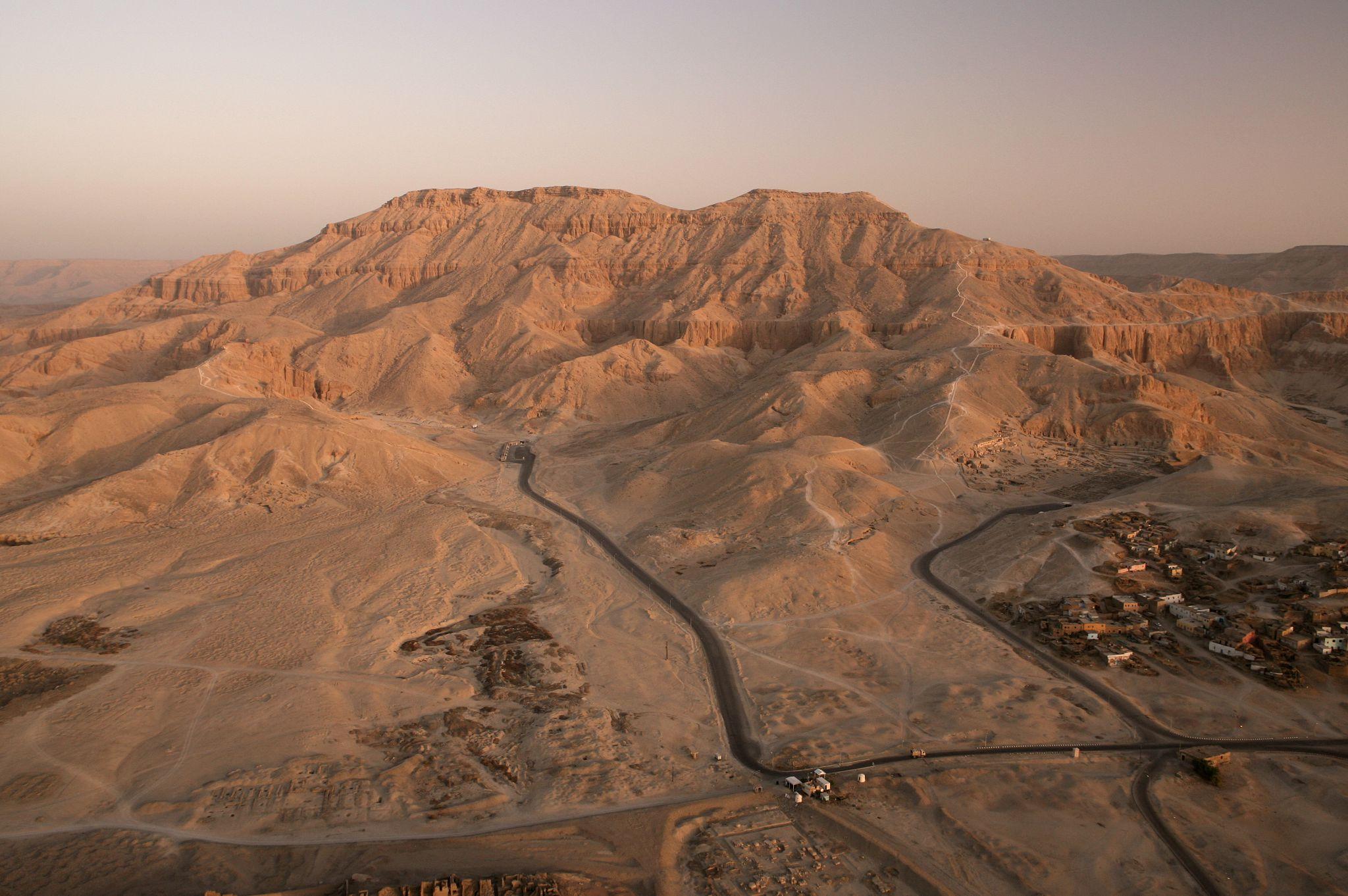 Aerial view of the Theban hills and Valley of the Queens at sunset near Luxor.