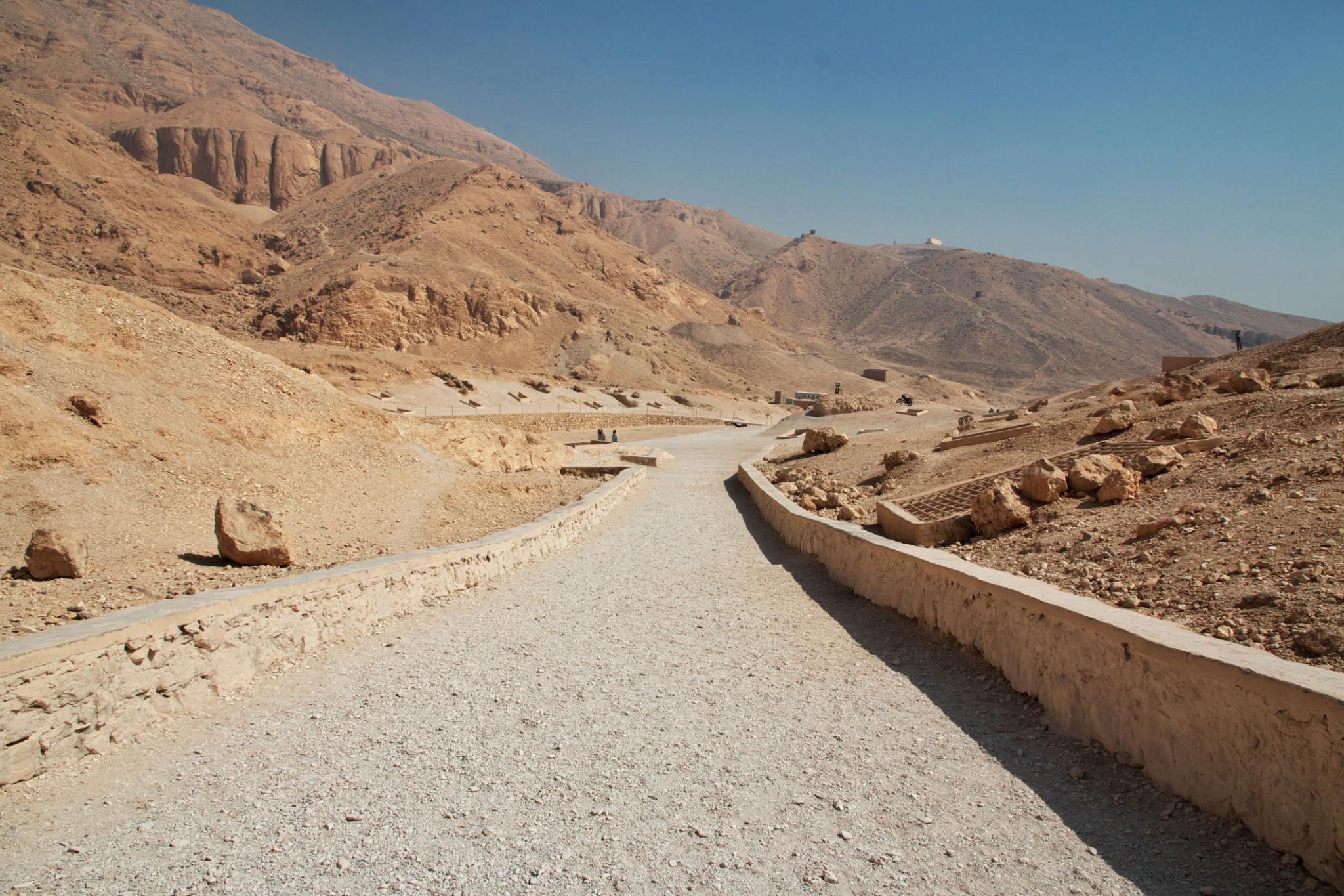 Gravel path leading into the arid cliffs of the Valley of the Queens near Luxor.
